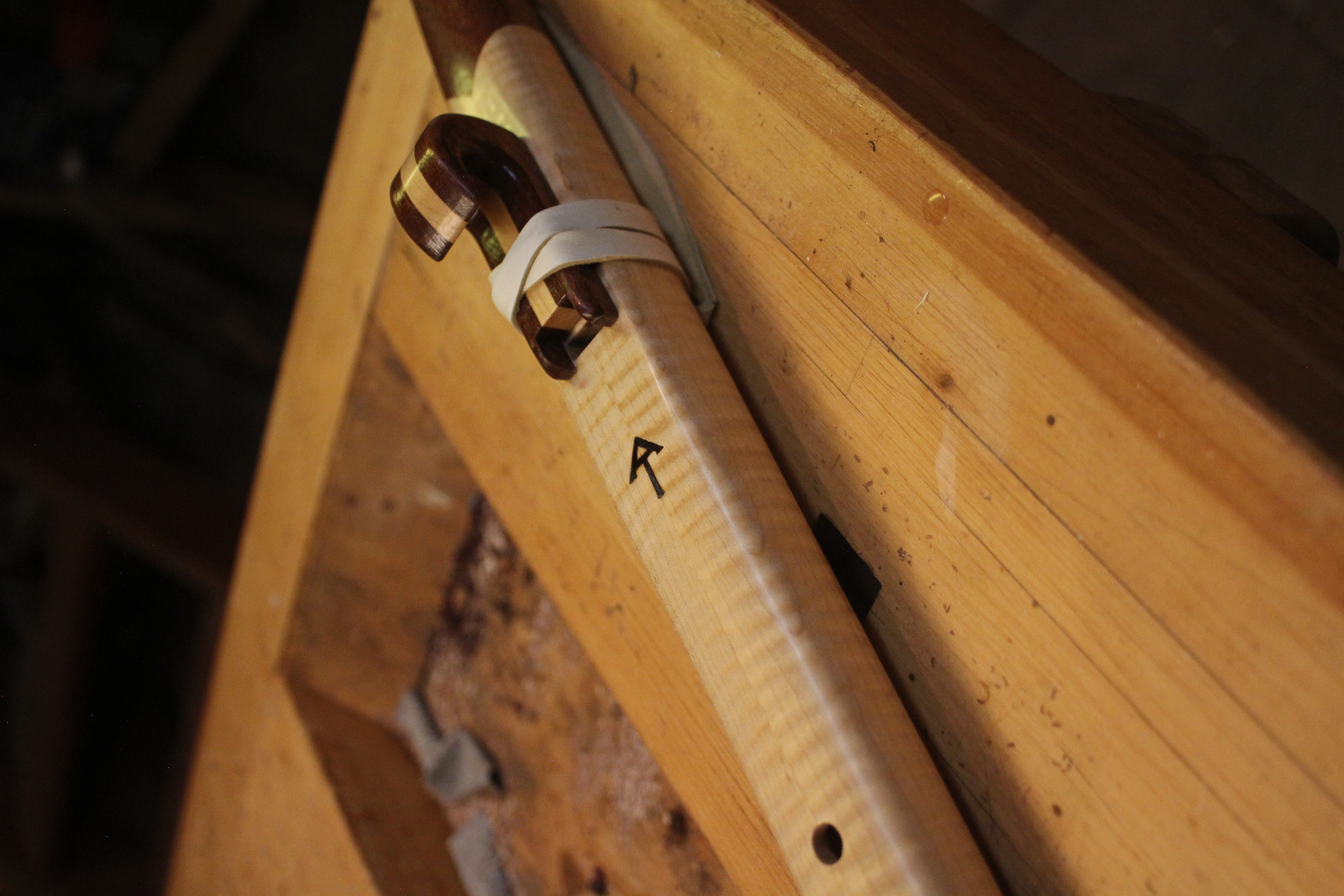 Native American style flute on workbench